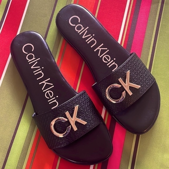 Brand New Calvin Klein Black Large Strap Sandals Flats w/ Gold Tone Metal Logo - Picture 12 of 12